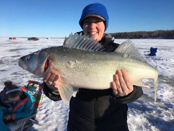 Kristen Unrau holds a walleye caught on Lake Winnipeg